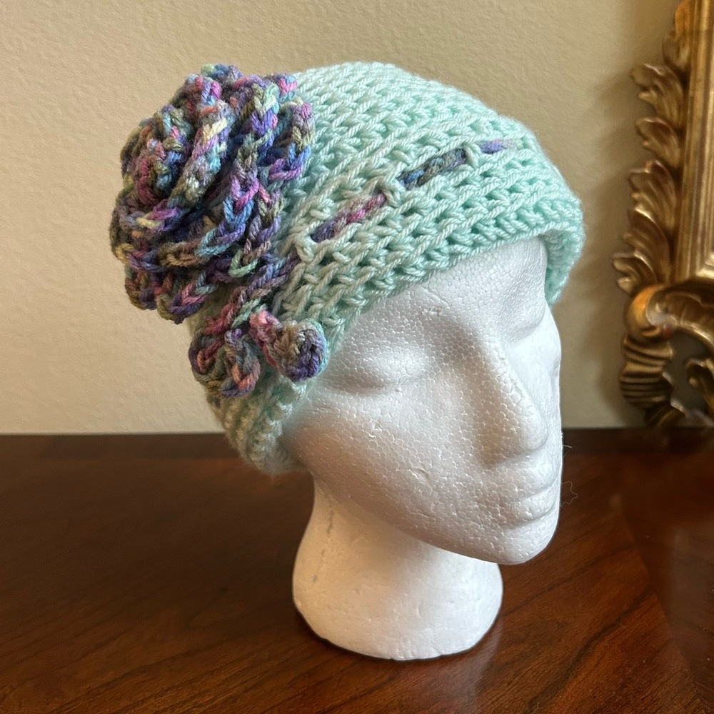 Handmade new aqua knit cap with multi color floral motif